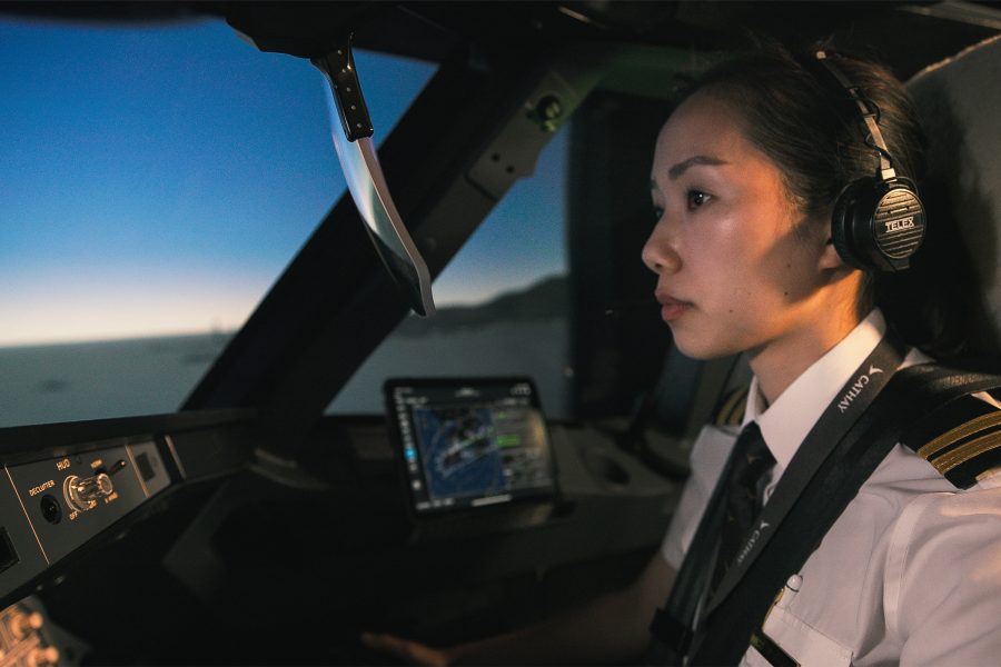 A crew member guides a simulated flight.
